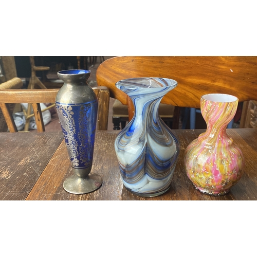 364 - Trio of decorative vases: blue glass with silver overlay, swirling blue and white glass, pink and ye... 