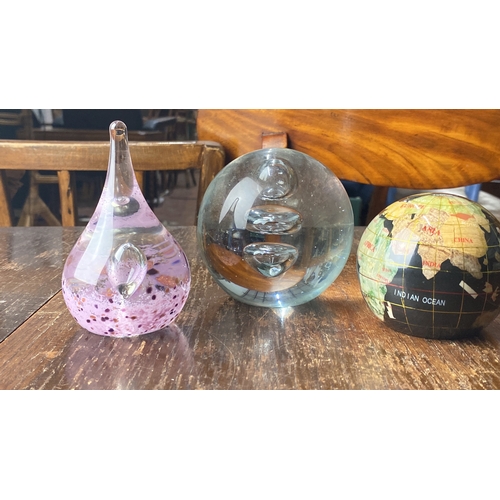 365 - Set of three decorative glass paperweights: a pink teardrop, a clear bubble-infused sphere, and a mi... 