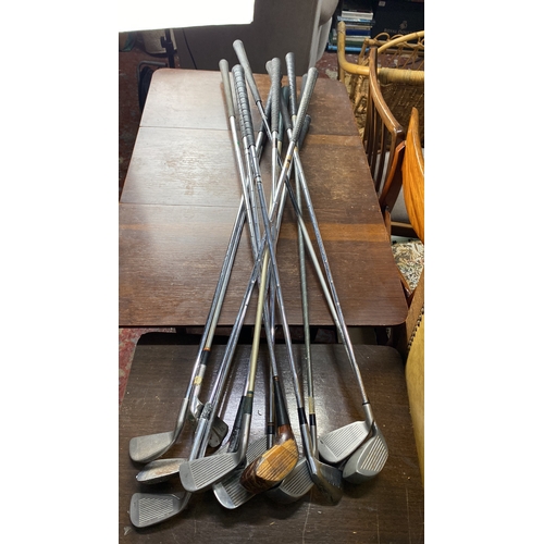 382 - Mixed lot of vintage golf clubs, featuring a variety of irons and a wood driver, with steel shafts a... 