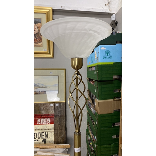 383 - Modern uplighter floor lamp with frosted glass shade, featuring a spiral design stand.