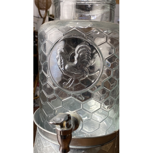 396 - Glass beverage dispenser with embossed rooster design, honeycomb pattern, and metal base. Includes l... 