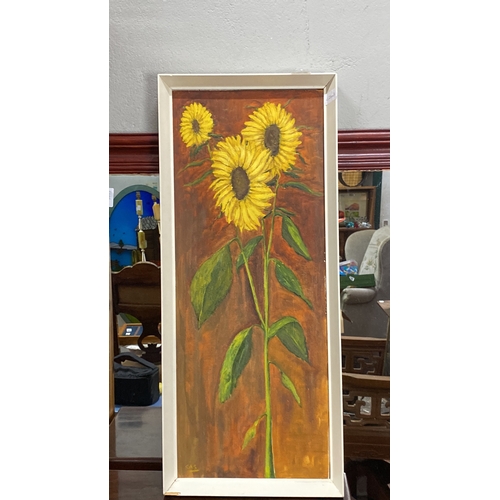 398 - Oil painting of sunflowers on canvas, framed. Vibrant depiction with a warm background. Artist's ini... 