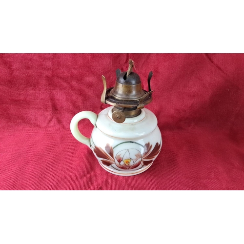 104 - Porcelain oil lamp with brass burner, floral design.