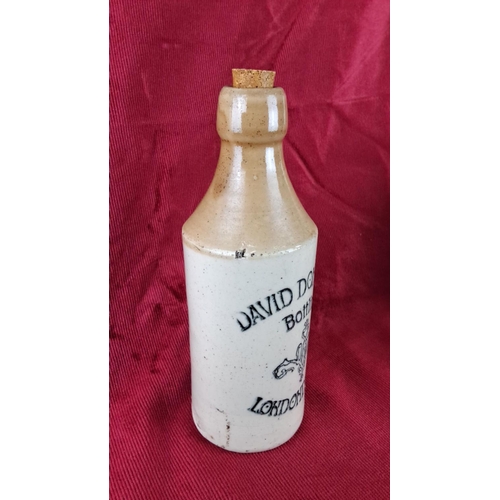 106 - Stoneware beer bottle with cork stopper, inscribed 