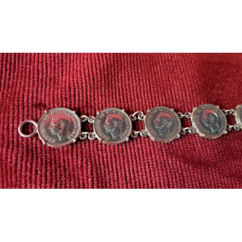 119 - Sterling silver bracelet features linked vintage coins with King George VI profiles.