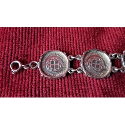 119 - Sterling silver bracelet features linked vintage coins with King George VI profiles.