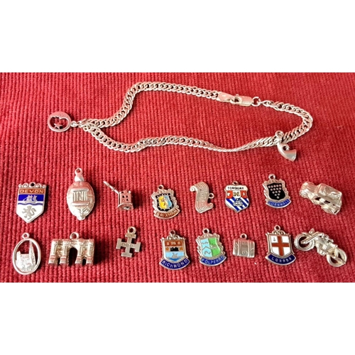 121 - Sterling silver charm bracelet with enamel and silver charms, including badges and miniature icons, ... 