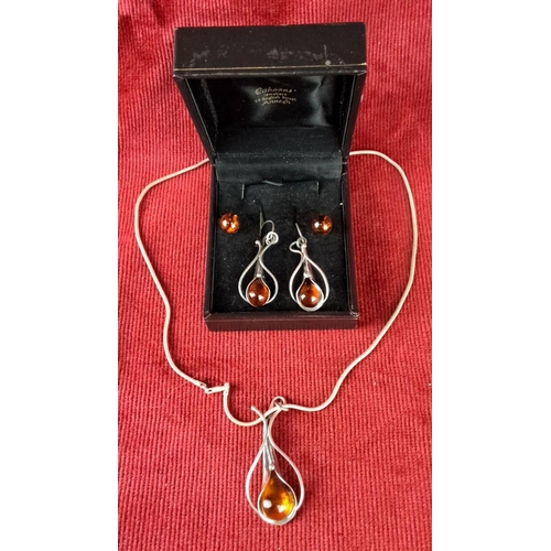 122 - Sterling silver jewellery set with amber gemstones, including a pendant necklace and matching earrin... 