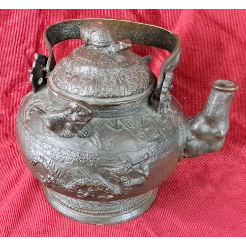 125 - Antique Oriental/ Chinese teapot with intricate dragon motifs and raised detailing, featuring a curv... 