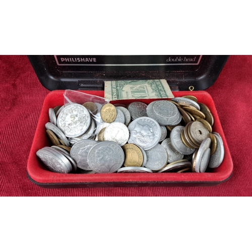 127 - Collection of coins in various denominations and currencies, including a 1974 US one dollar bill