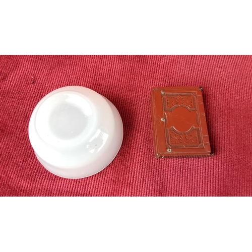 131 - White porcelain bowl and a vintage book-shaped match holder with 