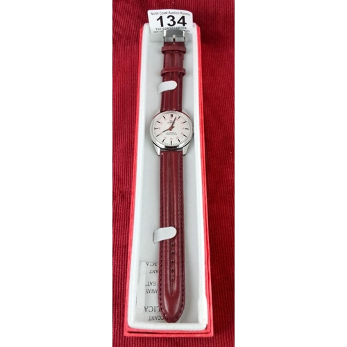 134 - Roamer wristwatch has 17 jewels, Para Shock feature, stainless steel case, and maroon leather strap.