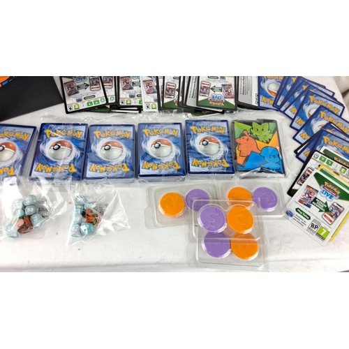 138 - Collection of Pokémon cards, to include booster packs, cards, dice, and counters in vibrant thematic... 