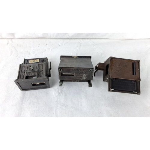 142 - Set of three vintage metal pencil sharpeners, featuring a slot machine, piano, and typographer desig... 