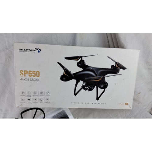 143 - Snaptain SP650 4-Axis Drone features voice control, trajectory flight, and 360° flip capabilities. I... 