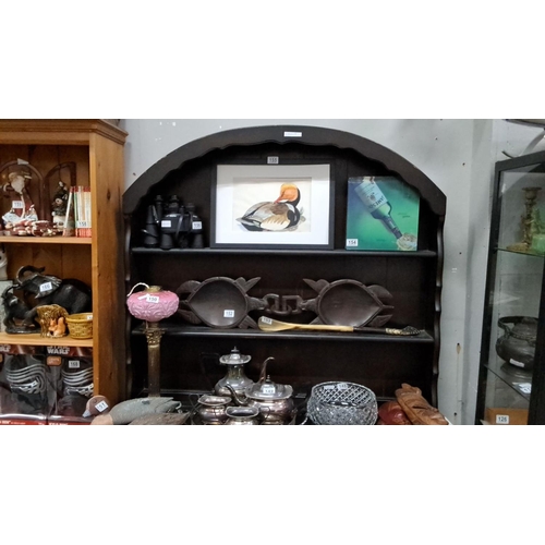 145 - Antique style dark-stained wood dresser with shelf display. Features decorative panelling and two lo... 