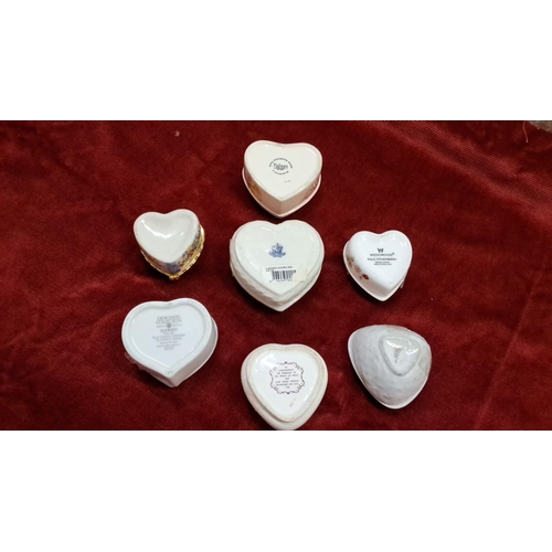 147 - Collection of seven heart-shaped porcelain trinket boxes with floral designs. Includes Wedgwood and ... 