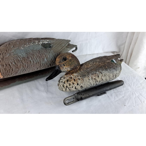 151 - Pair of vintage duck decoys, featuring detailed feather texture and lifelike paint.