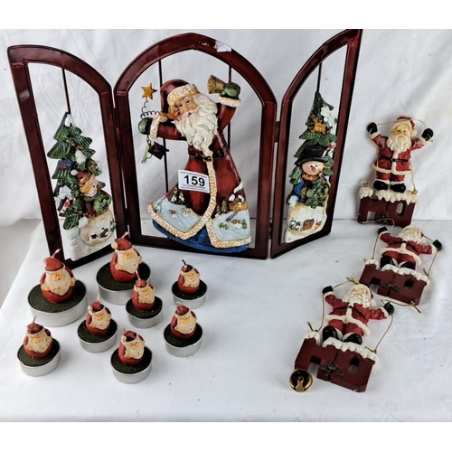 159 - Decorative lot  of Christmas themed items to includes a tri-fold panel, ceramic figures, and seven S... 