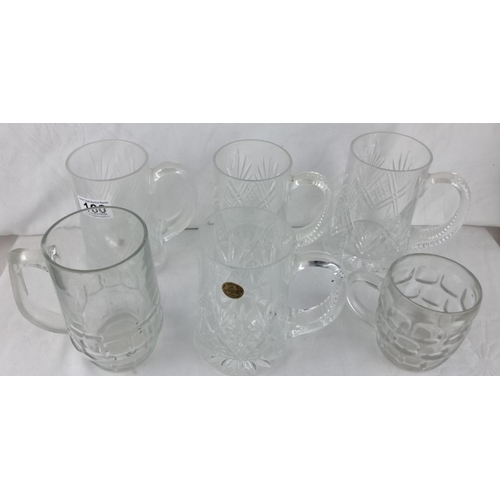 160 - Collection of glass beer mugs with various cut patterns, including diamond and geometric designs.