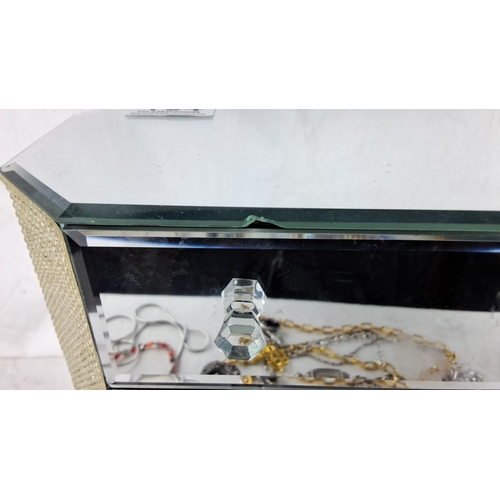 164 - Mirrored jewelry box with multiple compartments, featuring assorted jewelry pieces, including bracel... 