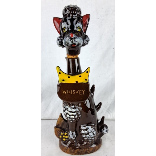 174 - Ceramic whiskey decanter, 1950s, featuring a whimsical dog design with a removable head stopper. Vib... 