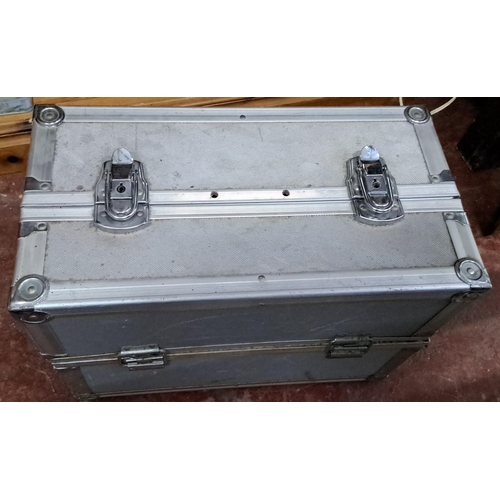 175 - Metal storage case with dual locks and foam interior, containing assorted tools and accessories.