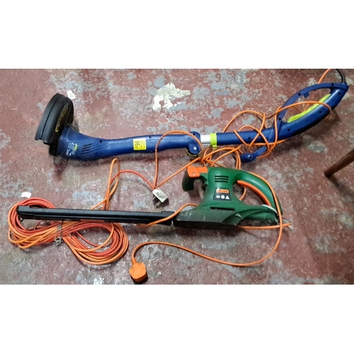 178 - An electric strimmer & hedge trimmer.