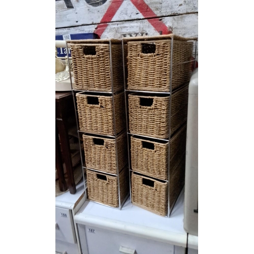 185 - Set of eight woven wicker storage baskets with metal frame.