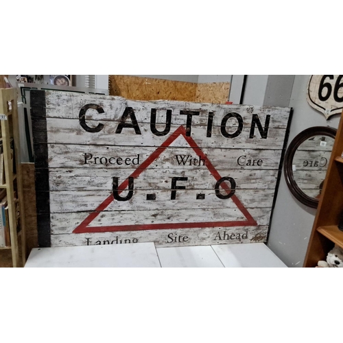 189 - Vintage-style wooden sign features the text 