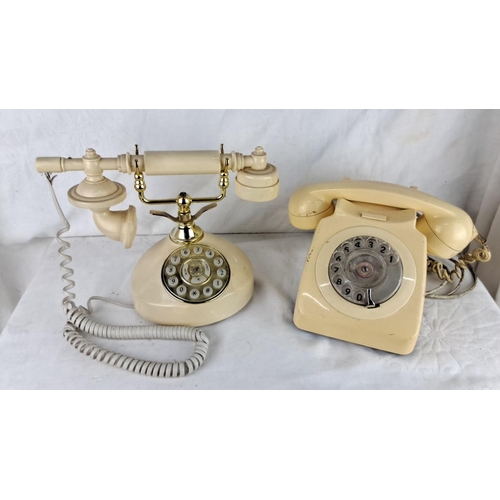 191 - Set of two vintage rotary telephones; one classic candlestick style with brass accents and one stand... 