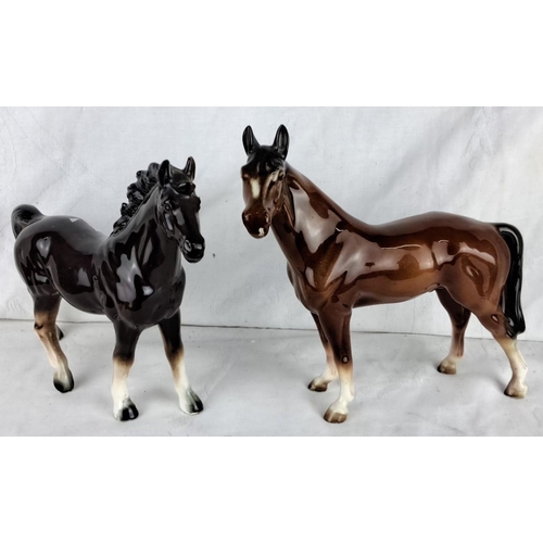 194 - Pair of porcelain horse figurines, glazed finish. One is black and one is brown, both with detailed ... 