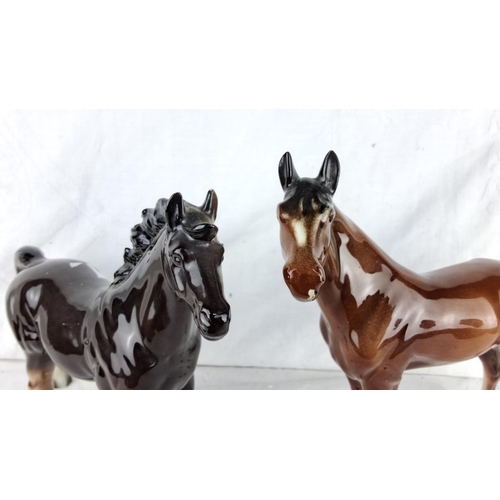 194 - Pair of porcelain horse figurines, glazed finish. One is black and one is brown, both with detailed ... 