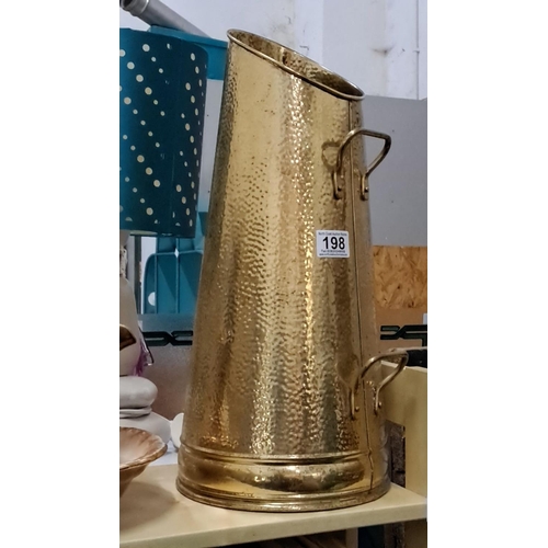 198 - Large hammered brass coal scuttle with dual handles features a classic tapered design.