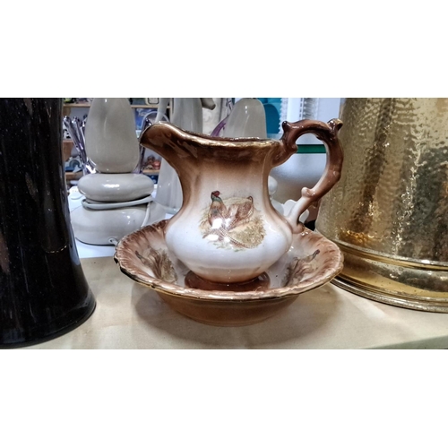 199 - Staffordshire Ceramic jug and basin set with pheasant motif.