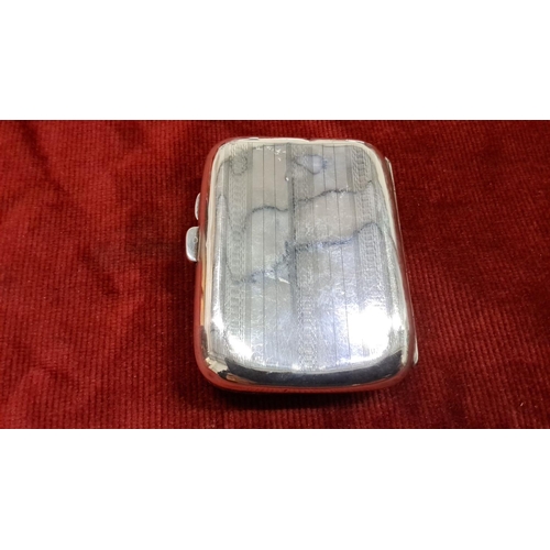 521 - Sterling silver cigarette case with engraved initials. Features hallmarks indicating Birmingham 1921... 