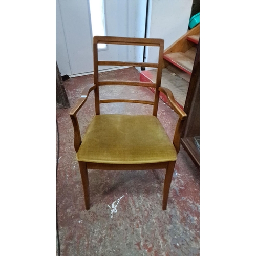 527 - Mid-Century Modern dining table and four chairs set, featuring a sleek teak design with ladder-back ... 