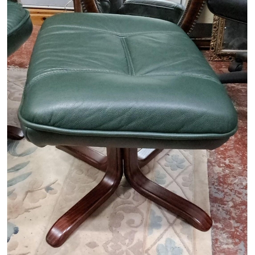 531 - Green leather swivel lounge chair with matching ottoman, featuring a padded backrest and wooden base... 