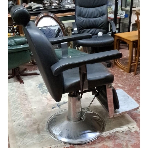 532 - Vintage black leather barber chair with chrome base and adjustable headrest.