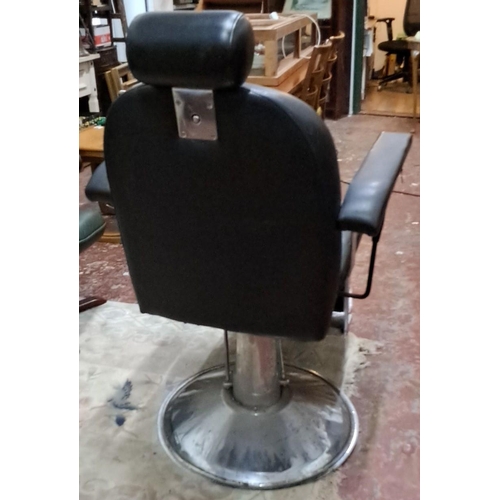 532 - Vintage black leather barber chair with chrome base and adjustable headrest.