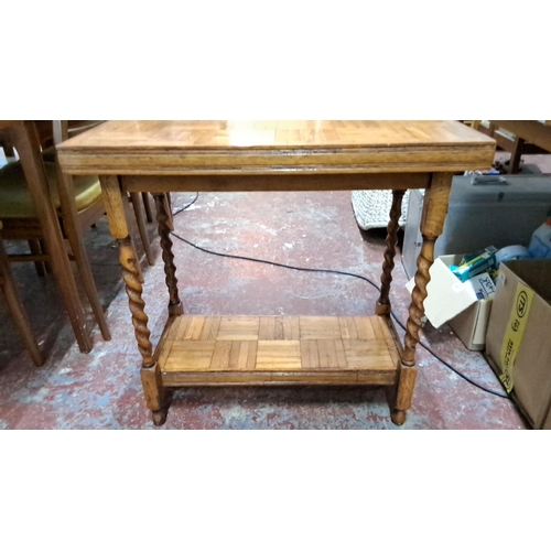 533 - Vintage oak console table with intricate parquet design and turned legs. Includes a lower shelf.