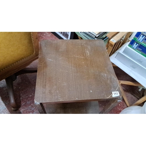 543 - Vintage oak side table with caster wheels, featuring a square top and lower shelf.