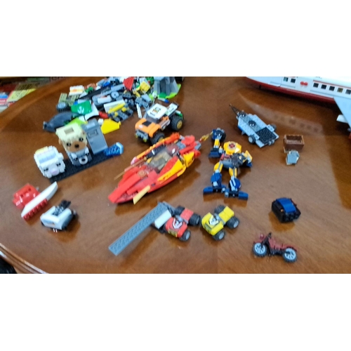 549 - Mixed lot of LEGO including airplane, vehicles, and various creative builds. Includes a large airpla... 