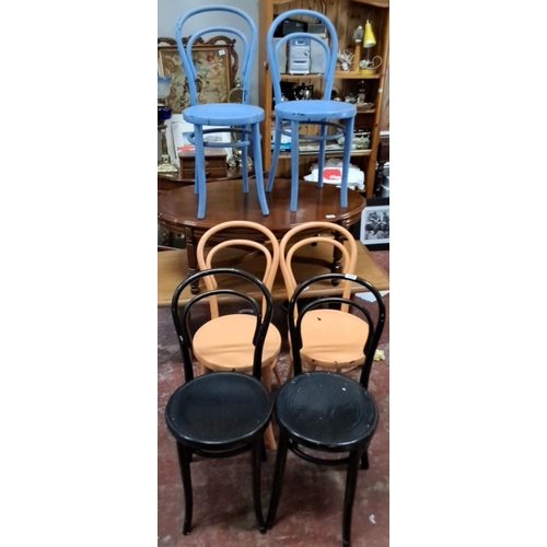 552 - Set of Thonet-style bentwood chairs, featuring various vibrant colors. Classic curved back design. T... 