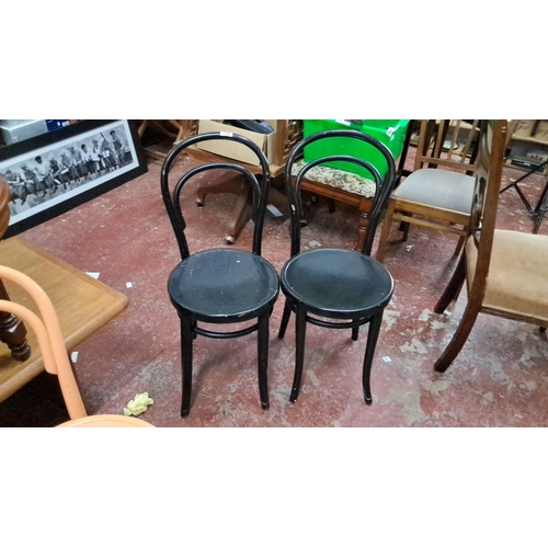 552 - Set of Thonet-style bentwood chairs, featuring various vibrant colors. Classic curved back design. T... 