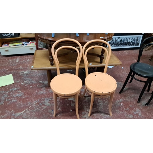 552 - Set of Thonet-style bentwood chairs, featuring various vibrant colors. Classic curved back design. T... 