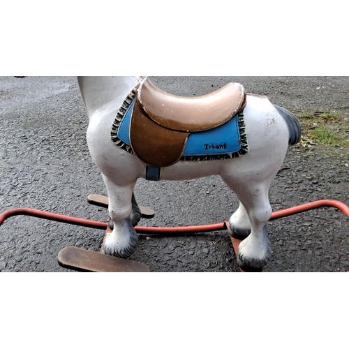 557 - Vintage Tri-ang rocking horse, painted metal with brown saddle and blue detailing, on a sturdy red m... 