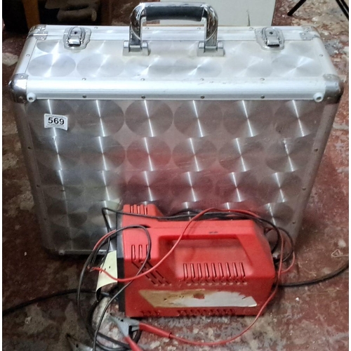 569 - Aluminum carrying case with Charge 'N Start 12V automatic battery charger.