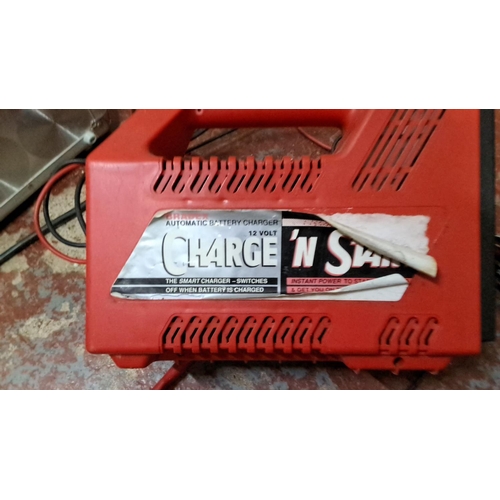 569 - Aluminum carrying case with Charge 'N Start 12V automatic battery charger.