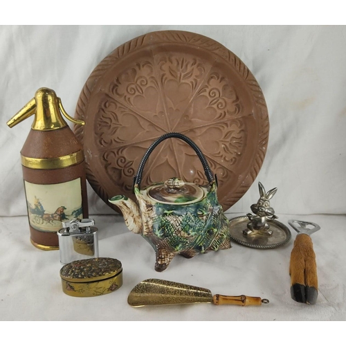 410 - Collection includes a ceramic teapot, embossed plate, vintage seltzer bottle, lighter, metal rabbit ... 